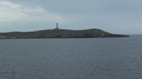 Lighthouse on an island 2 Stock Footage 32836700