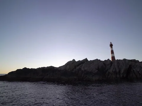 Lighthouse island. Camera move right. 4k Stock Footage 77973885