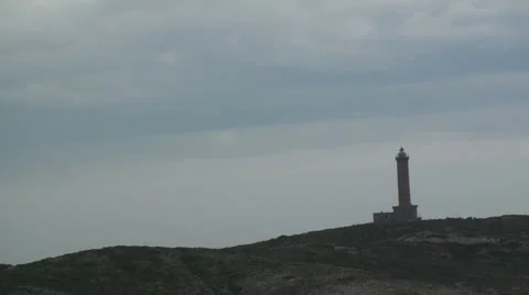 Lighthouse on an island Stock Footage 22979230