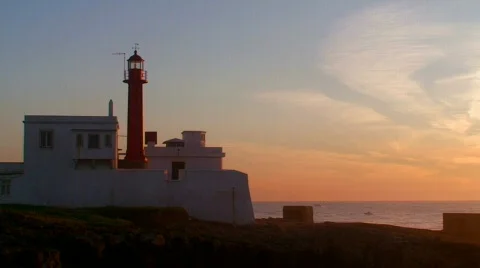 Lighthouse on the island at sunset Stock Footage 100571