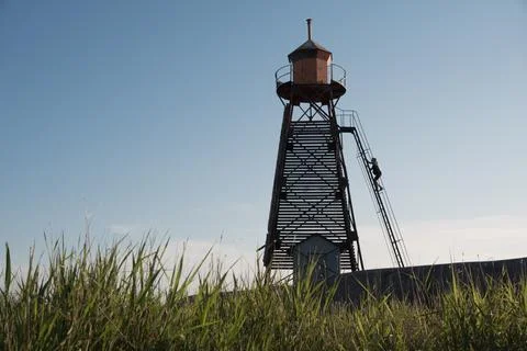 The lighthouse keeper climbs the ladder Foto stock