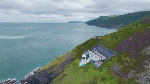 The Lighthouse Keepers Cottage from a drone, Foreland Point, Lynton, Devon, UK Video stock 248524990