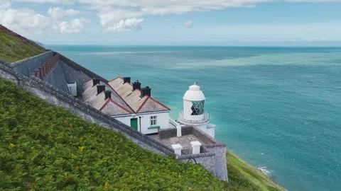 The Lighthouse Keepers Cottage from a drone, Foreland Point, Lynton, Devon, UK Stock Footage 248525084