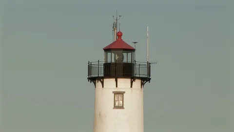 Lighthouse light beam flashing in Gloucester harbor Massachusetts USA Stock Footage 101980530