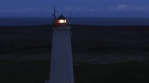 Lighthouse with Light Beam at Night Stock Footage 324906165
