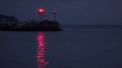 Lighthouse Light is reflected in the sea Stock Footage 72236665