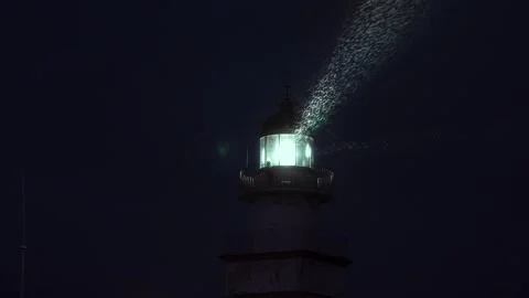Lighthouse light while raining in slow motion Stock Footage 297792353