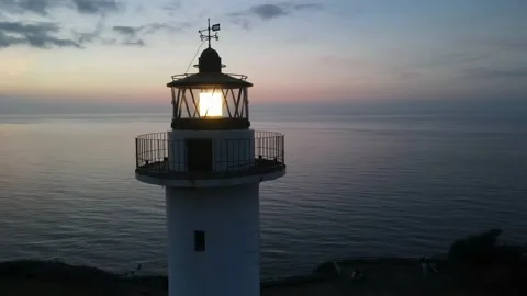 Lighthouse lit after sunset Video stock 165994141