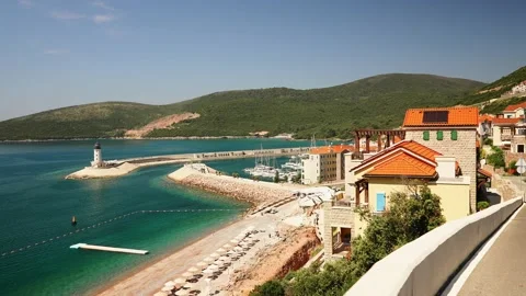 Lighthouse in Lustica Bay surrounded by mountains in Montenegro. Picturesque Stock Footage 201412703