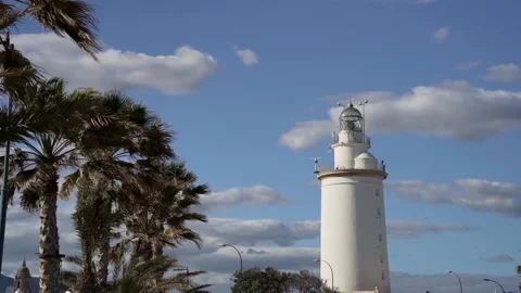 Lighthouse of Malaga and palm trees, Spain Stock Footage 240015423