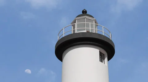 Lighthouse with moon in background Stock Footage 33035166