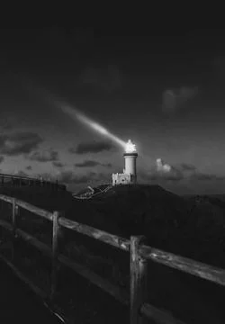 Lighthouse on the mountain at night 스톡 사진