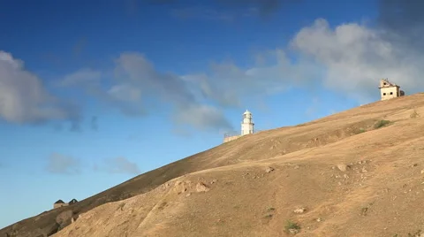 Lighthouse. The movement of clouds on the mountain Meganom, Crimea, Russia Stock Footage 42039878