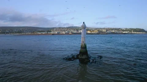 Lighthouse on Ness Cove Beach from a drone, Shaldon, Teignmouth, Devon, England 動画素材 163806586