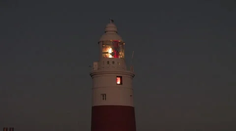 Lighthouse at night gives aid to navigation &amp; safety Stock Footage 40162895
