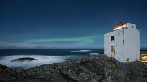 Lighthouse with Northern Lights on the coast Stock Footage 147432532