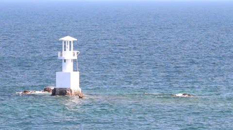 Lighthouse in the ocean with sky Stock Footage 32789801