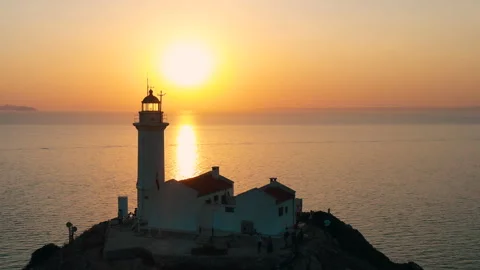 Lighthouse om the sunset background. Stock Footage 256210436