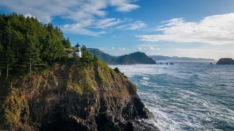 Lighthouse by the oregon cliff Stock Photos