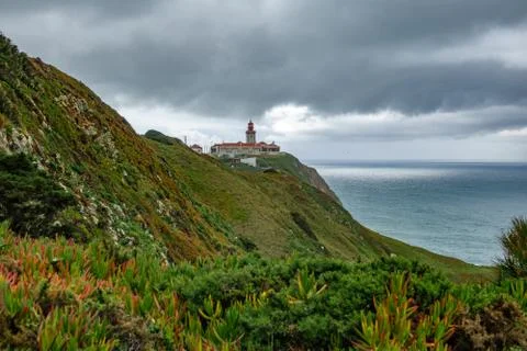 Lighthouse over the cliffs Stock Photos