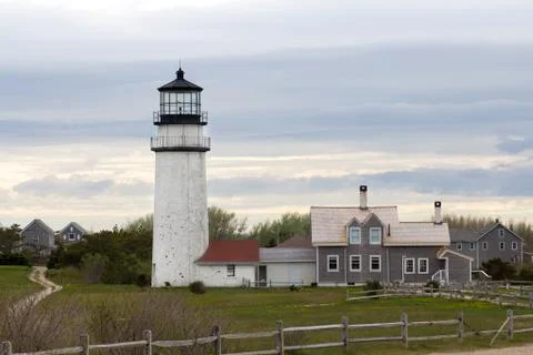 Lighthouse over cloudy sky Stock Photos
