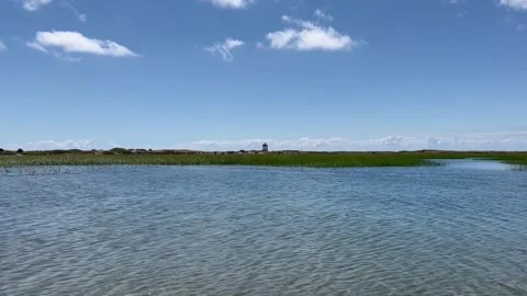 Lighthouse over marsh in Cape Cod, Massachusetts. Summer 2022 Stock Footage 243037748