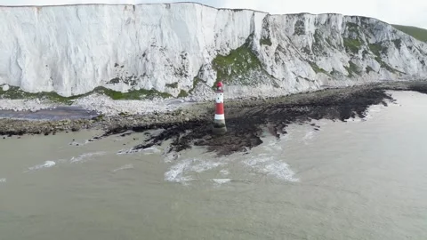 Lighthouse over sea towards Beachy Head Light House, East Sussex, UK Stock Footage 245427708
