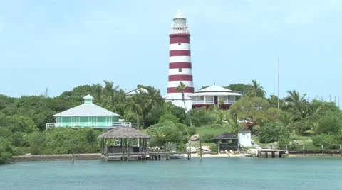 Lighthouse overlooking a marina Stock Footage 12570373