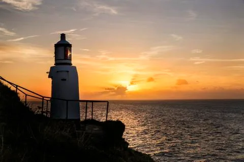 Lighthouse overlooking sea 库存照片