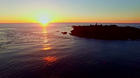 A lighthouse on Pacific ocean at sunset Stock Footage 55662219