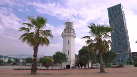 Lighthouse, Palms, And Bicycle On The Boulevard Stock-Footage 136725052