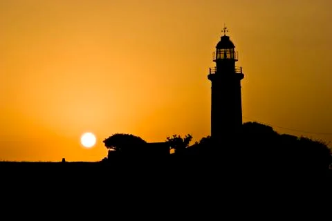 Lighthouse of Paphos at sunset Stock Photos