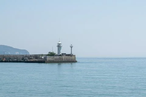 Lighthouse on the pier during the day Foto stock