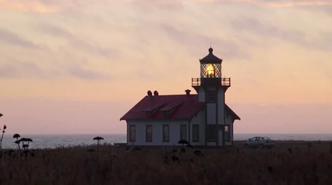 Lighthouse at Point Cabrillo, dusk with car Stock Footage 64887227