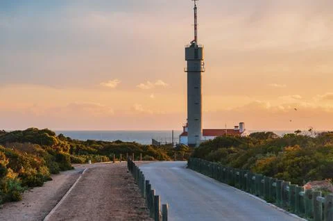 Lighthouse of Ponta do Altar under gloomy sunset sky Stock Photos