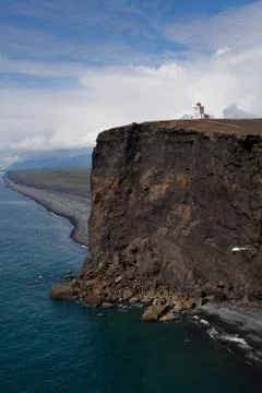 Lighthouse on remote cliff Stock Photos