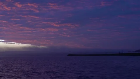 Lighthouse on a River with Dramatic Magenta Sky at Predawn Video stock 138440492