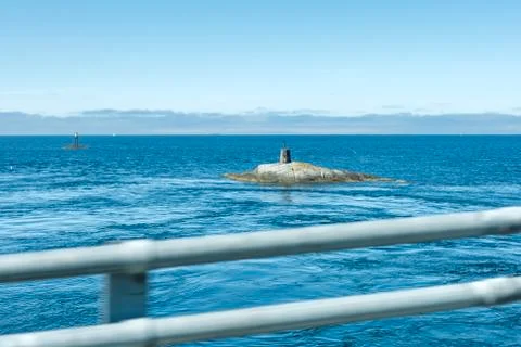 Lighthouse on the rock Stock Photos