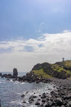 Lighthouse on a rock Stock Photos