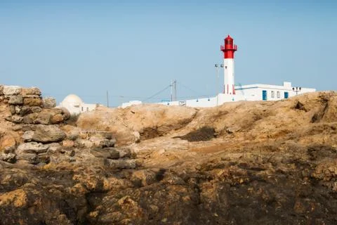Lighthouse on the rocks Stock Photos