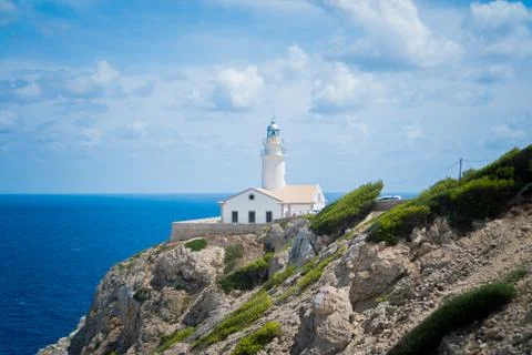 Lighthouse on the rocks 스톡 사진