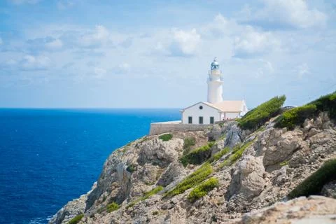 Lighthouse on the rocks 스톡 사진