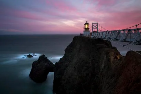 Lighthouse on rocky cliffs over ocean coastline, Sausalito, California, United Stock Photos