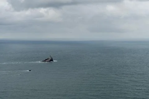 Lighthouse On Rocky Sea Stack Off Oregon Coast At Ecola State Park Stock Photos