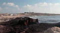 Lighthouse on rocky seaside of Cyprus island. Paphos city, Faros beach HD Footage