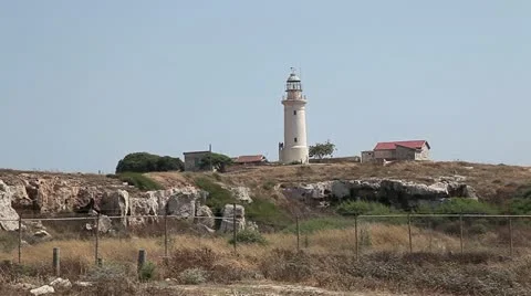 Lighthouse on the rocky shore in Pathos . Stock Footage