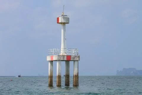 Lighthouse in the sea Stock Photos