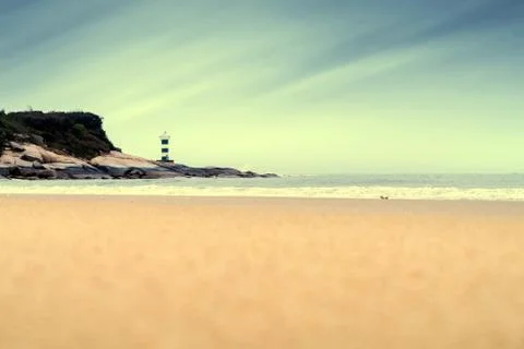 Lighthouse by the sea Stock Photos