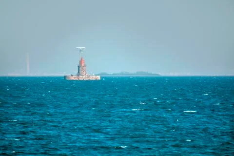 Lighthouse in the sea Stock Photos