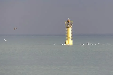 Lighthouse in the sea Stock Photos